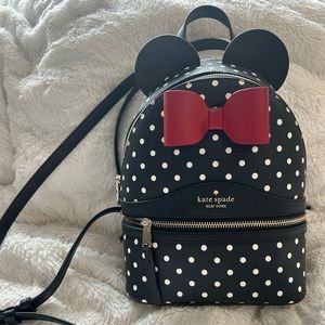 Disney X kate spade Minnie Mouse black with white polka dots backpack.